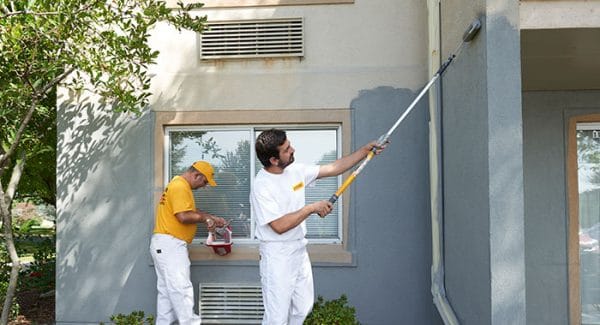Professional painter working on a home exterior